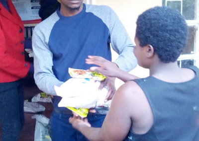 3Donating food items to victims of heavy rains in Chilobwe in 2019
